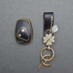 کاور ریموت ال نود و ساندرو طرح چرم با بند ست نگین دار