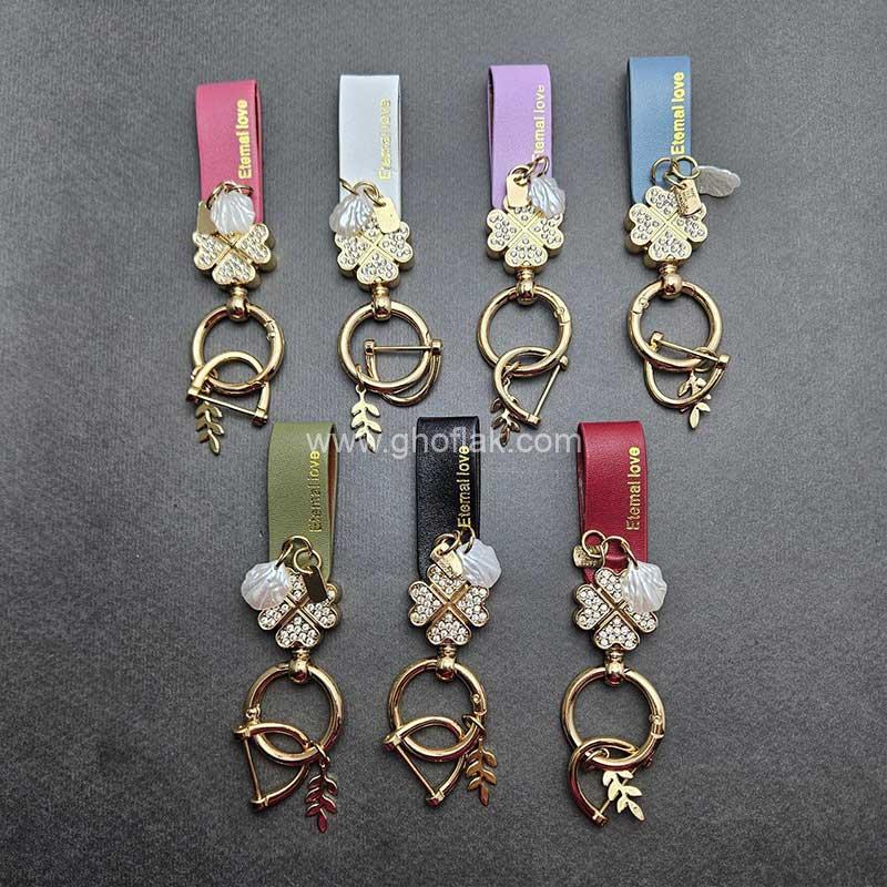 آویز-چرم-نگین-دار-یراق-طلایی-01 آویز چرم نگین دار یراق طلایی - Image 1