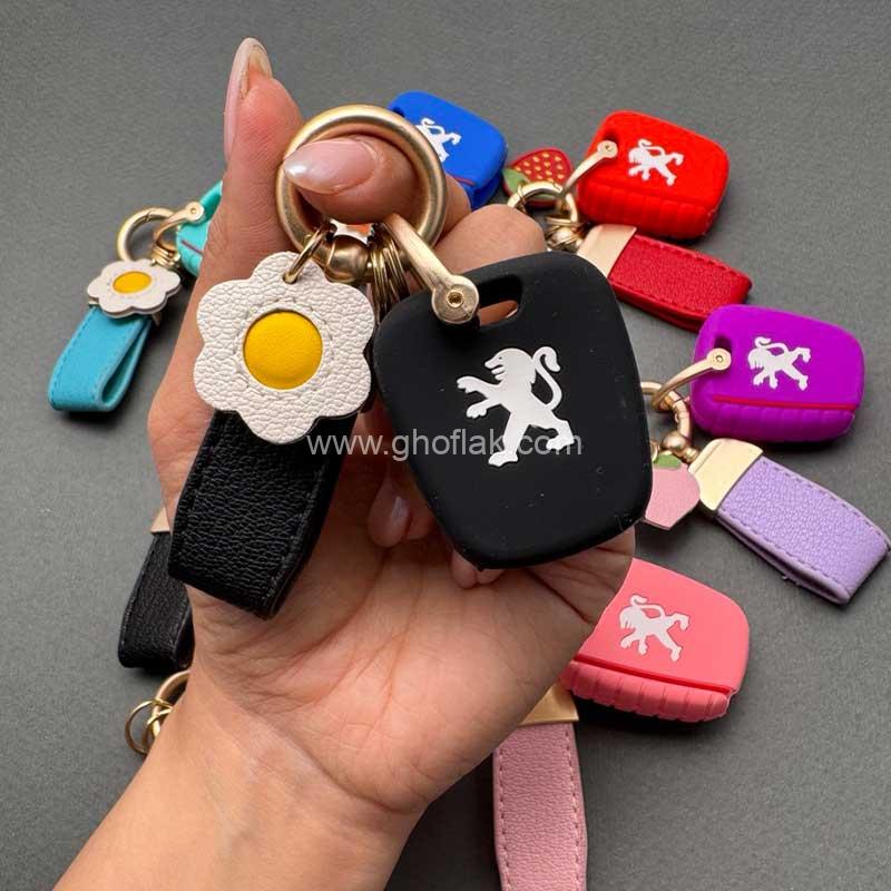 206-سیلیکونی-با-بند-فانتزی کاور ریموت پژو 206 - 207 - پارس مدل بالا - رانا سیلیکونی با بند چرم کوتاه - Image 1