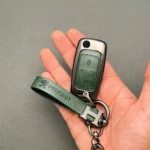 کاور ریموت پژو 405 و پارس کلید تاشو دو دکمه با بند دور فلزی وسط چرم اعلا - Image 2