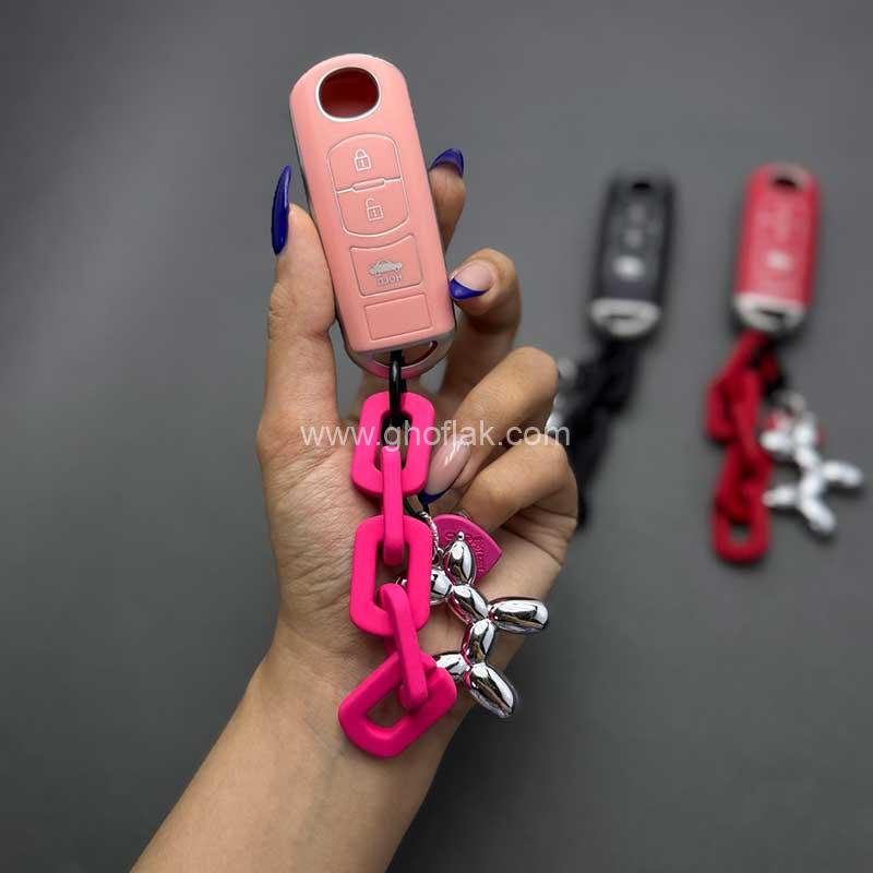 کاور-ریموت-مزدا-3-کیلس-طرح-چرم-با-بند-ست-سگ-بادکنکی-003 کاور ریموت مزدا 3 کیلس طرح چرم با بند ست سگ بادکنکی - Image 1