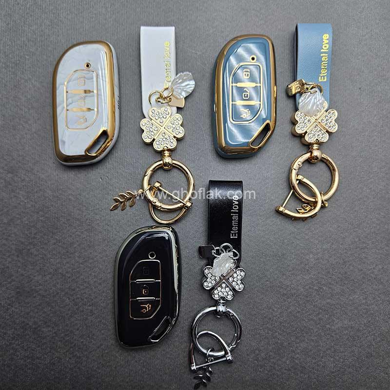 کاور-ریموت--لاماری-FMC-براق-با-بند-ست-نگین-دار کاور ریموت لاماری FMC براق با بند ست نگین دار - Image 1