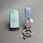 کاور ریموت مزدا 3 کلید تاشو طرح چرم با بند ست نگین دار - Image 3