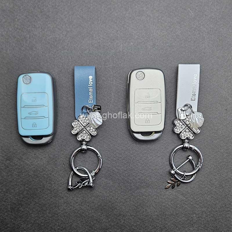 کاور-ریموت-چانگان-کلید-تاشو-طرح-چرم-با-بند-ست-نگین-دار-01 کاور ریموت چانگان کلید تاشو طرح چرم با بند ست نگین دار - Image 1